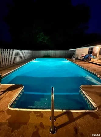 an aerial view of a house with a lake view