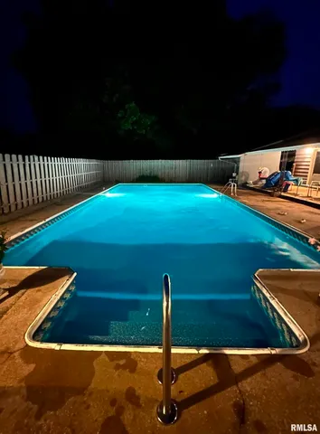 an aerial view of a house with a lake view