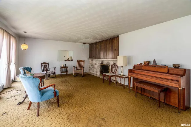 a kitchen with stainless steel appliances kitchen island granite countertop a stove a sink and a refrigerator