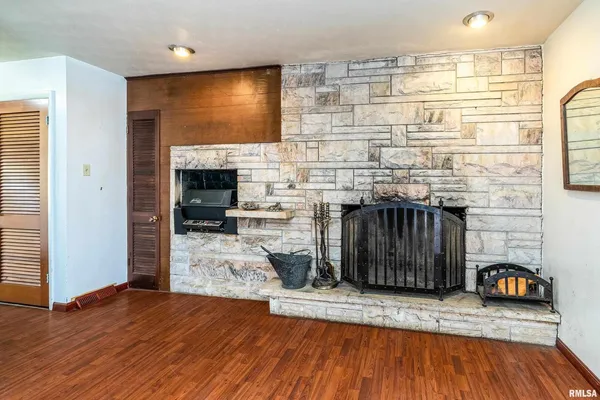 a view of a livingroom with furniture and a flat screen tv