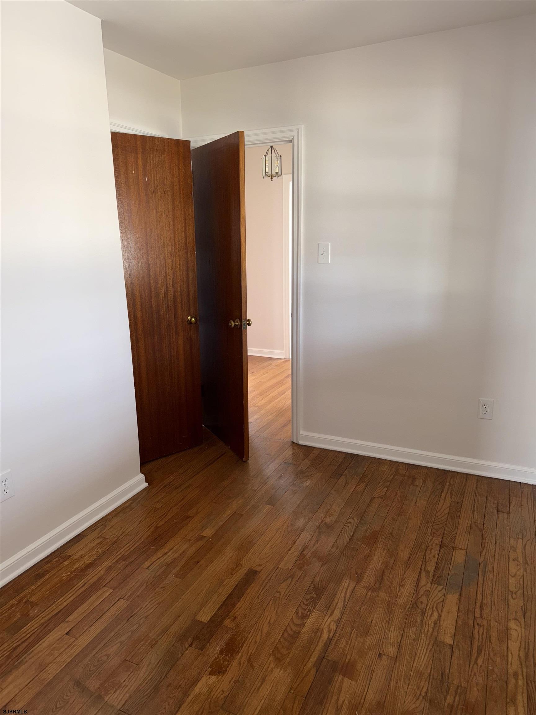 661 Grape Street Hammonton, NJ 08037 - Photo 13 of 14 an empty room with wooden floor