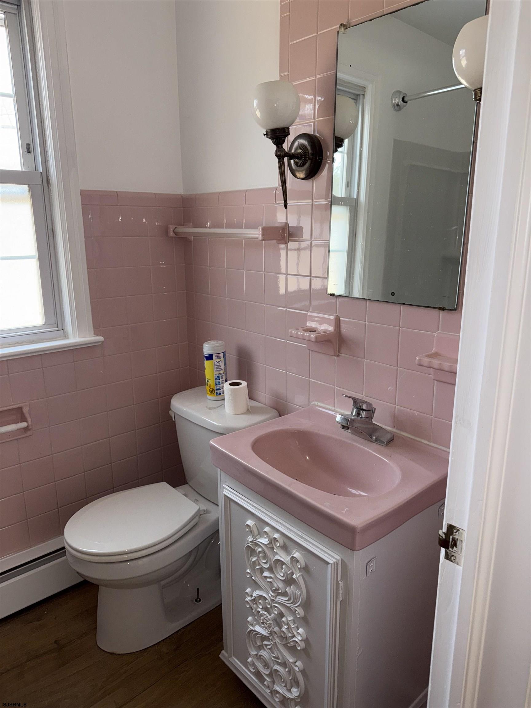 661 Grape Street Hammonton, NJ 08037 - Photo 10 of 14 a bathroom with a toilet sink and mirror