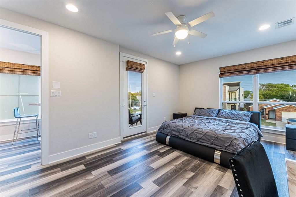 4013 Ivanhoe Lane Dallas, TX 75212 - Photo 14 of 38 Bedroom featuring dark wood-type flooring, ceiling fan, and access to outside