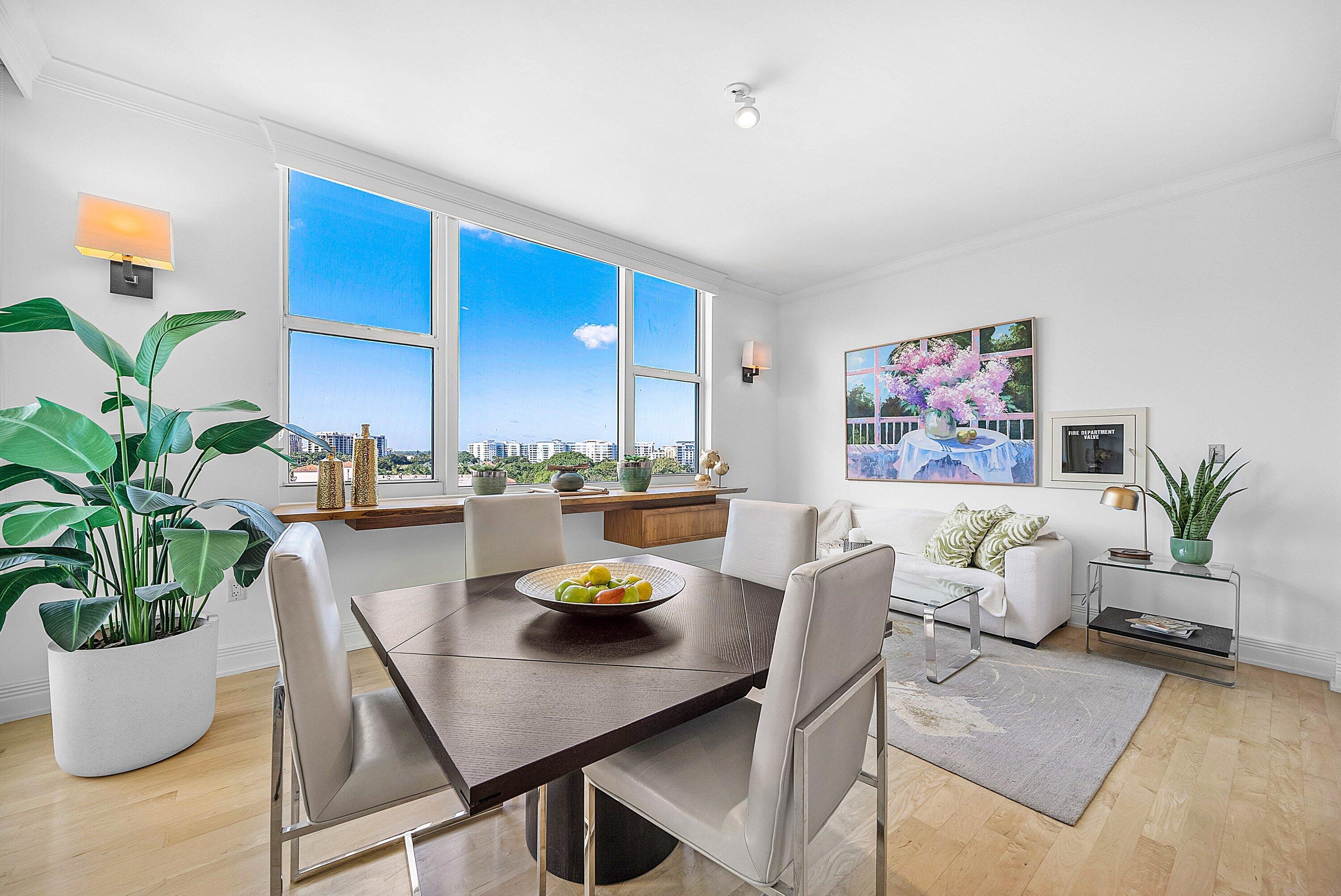 400 Southeast 5th Avenue, Unit 805N Boca Raton, FL 33432 - Photo 14 of 58 a living room with dining table and a potted plant