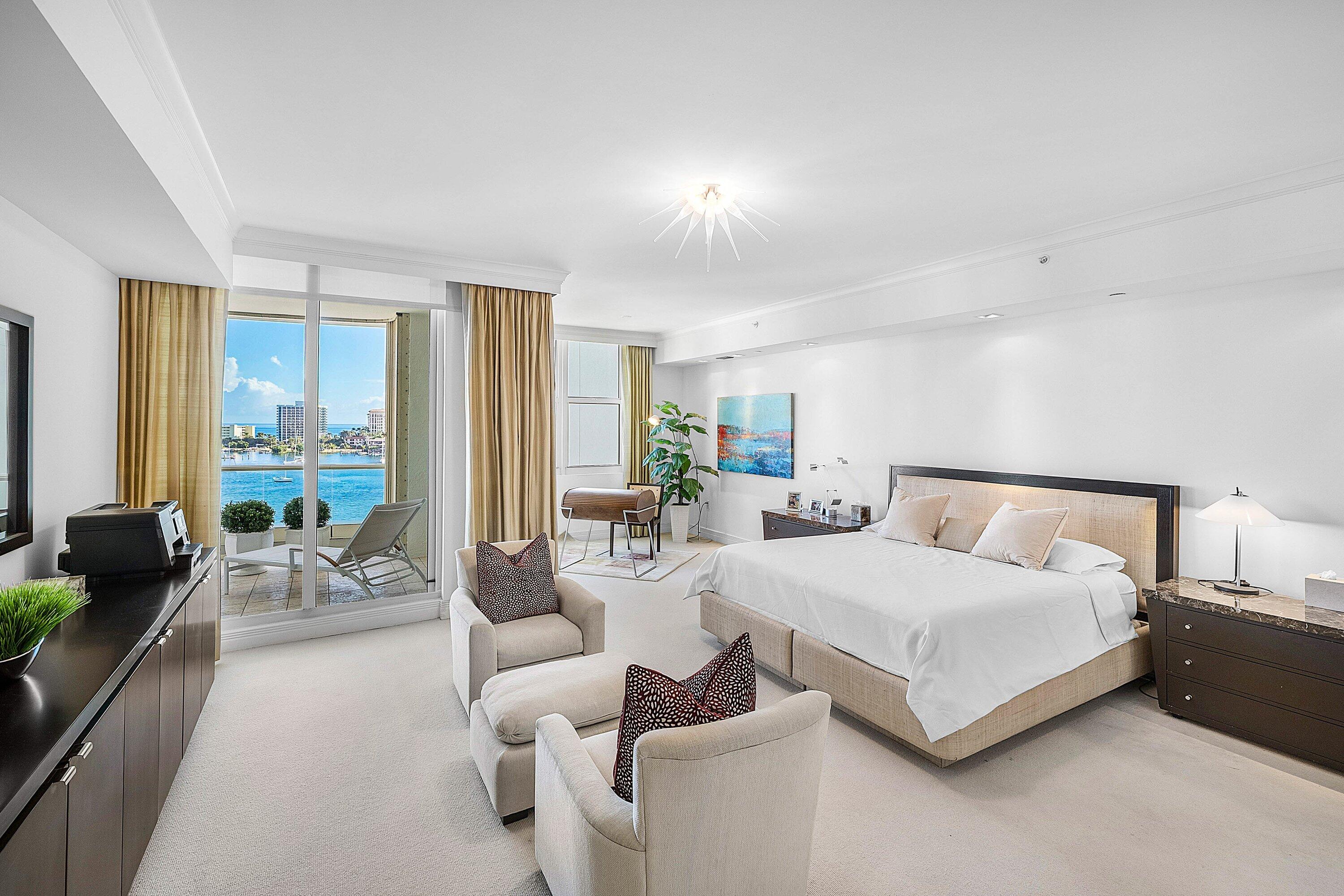 400 Southeast 5th Avenue, Unit 805N Boca Raton, FL 33432 - Photo 15 of 58 a spacious bedroom with a bed a couch and a large window