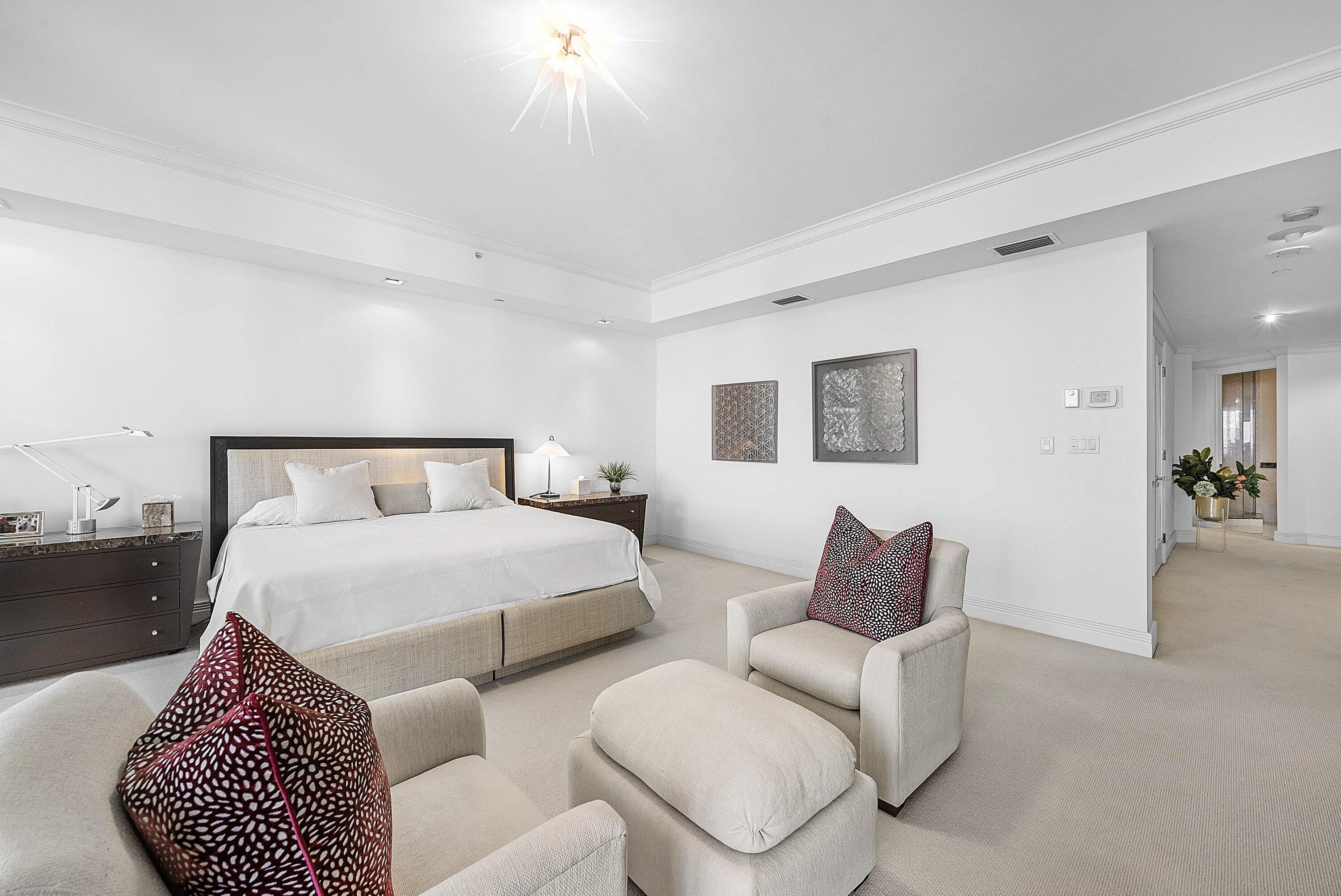 400 Southeast 5th Avenue, Unit 805N Boca Raton, FL 33432 - Photo 18 of 58 a bedroom with a bed and a couch