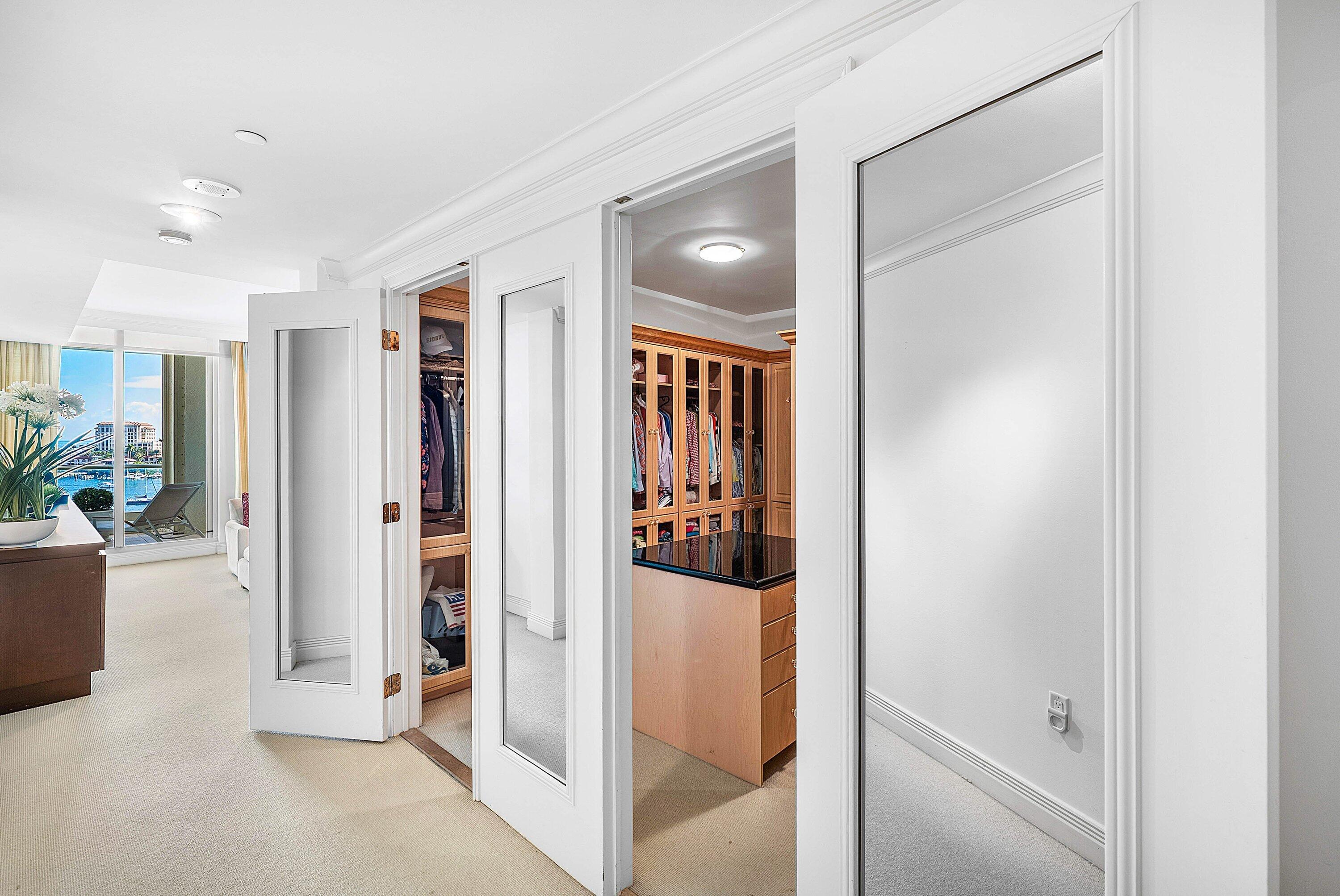 400 Southeast 5th Avenue, Unit 805N Boca Raton, FL 33432 - Photo 20 of 58 a view of a hallway with dining area and glass door