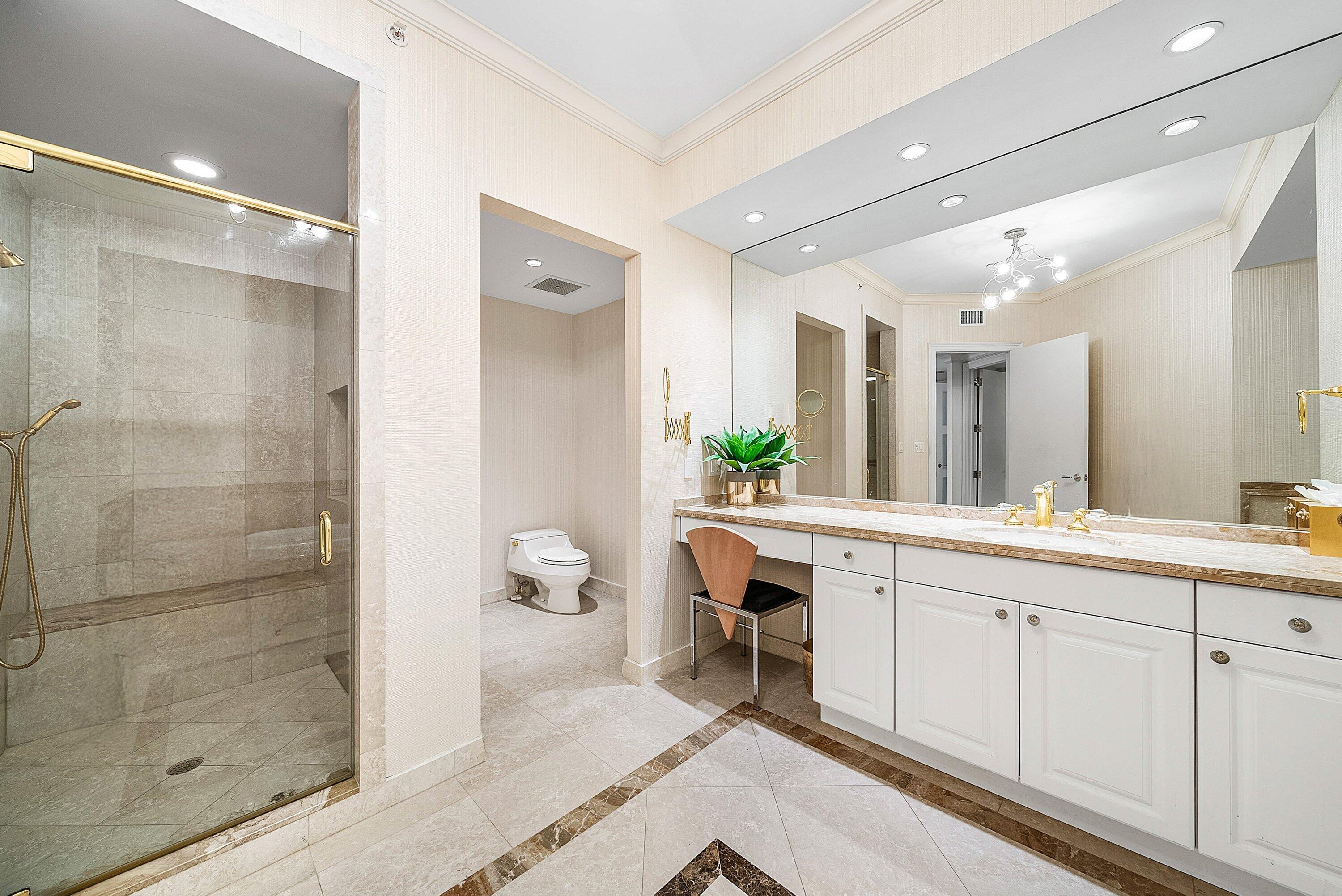 400 Southeast 5th Avenue, Unit 805N Boca Raton, FL 33432 - Photo 22 of 58 a spacious bathroom with a shower sink and mirror