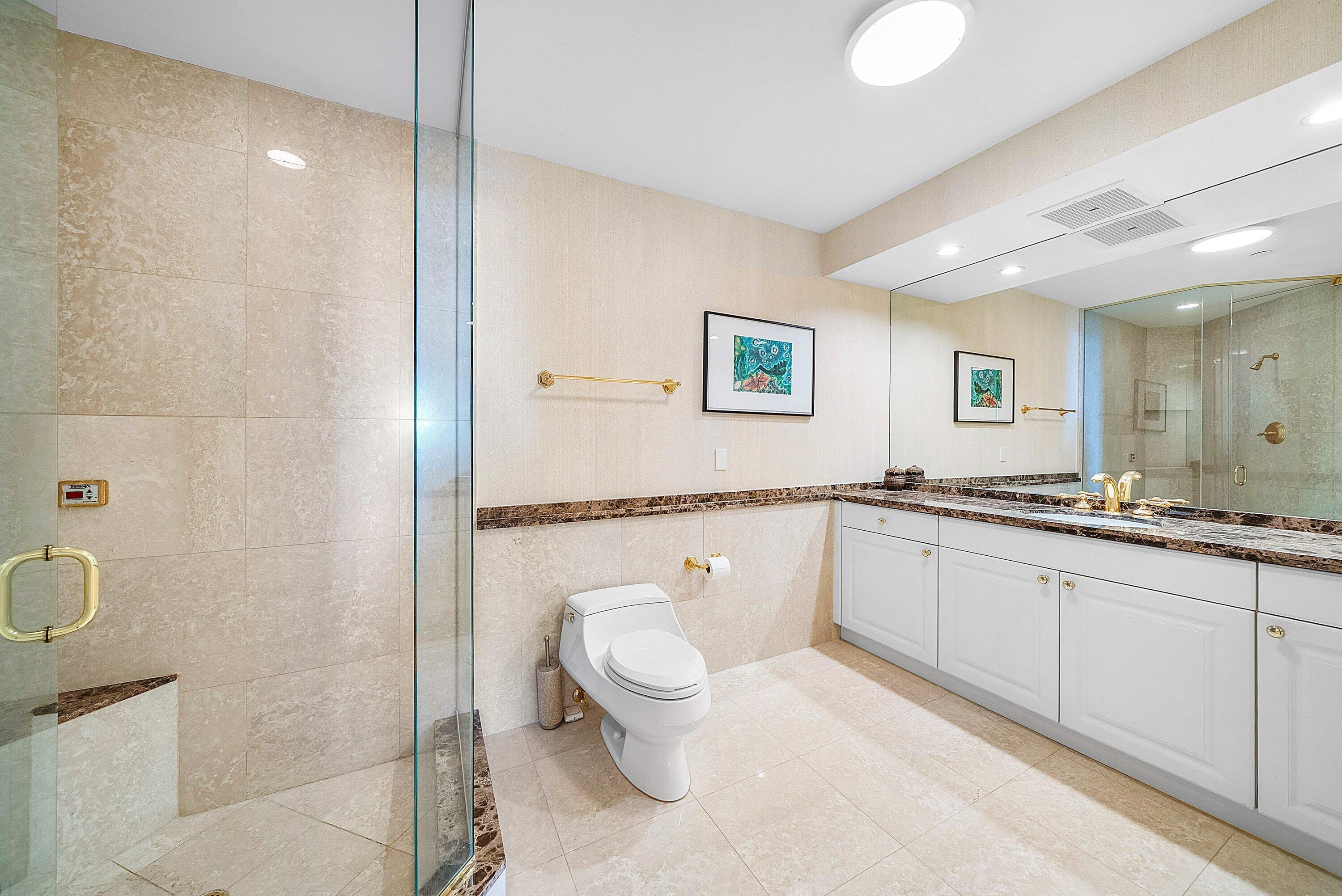 400 Southeast 5th Avenue, Unit 805N Boca Raton, FL 33432 - Photo 23 of 58 a spacious bathroom with a granite countertop sink a toilet and a shower