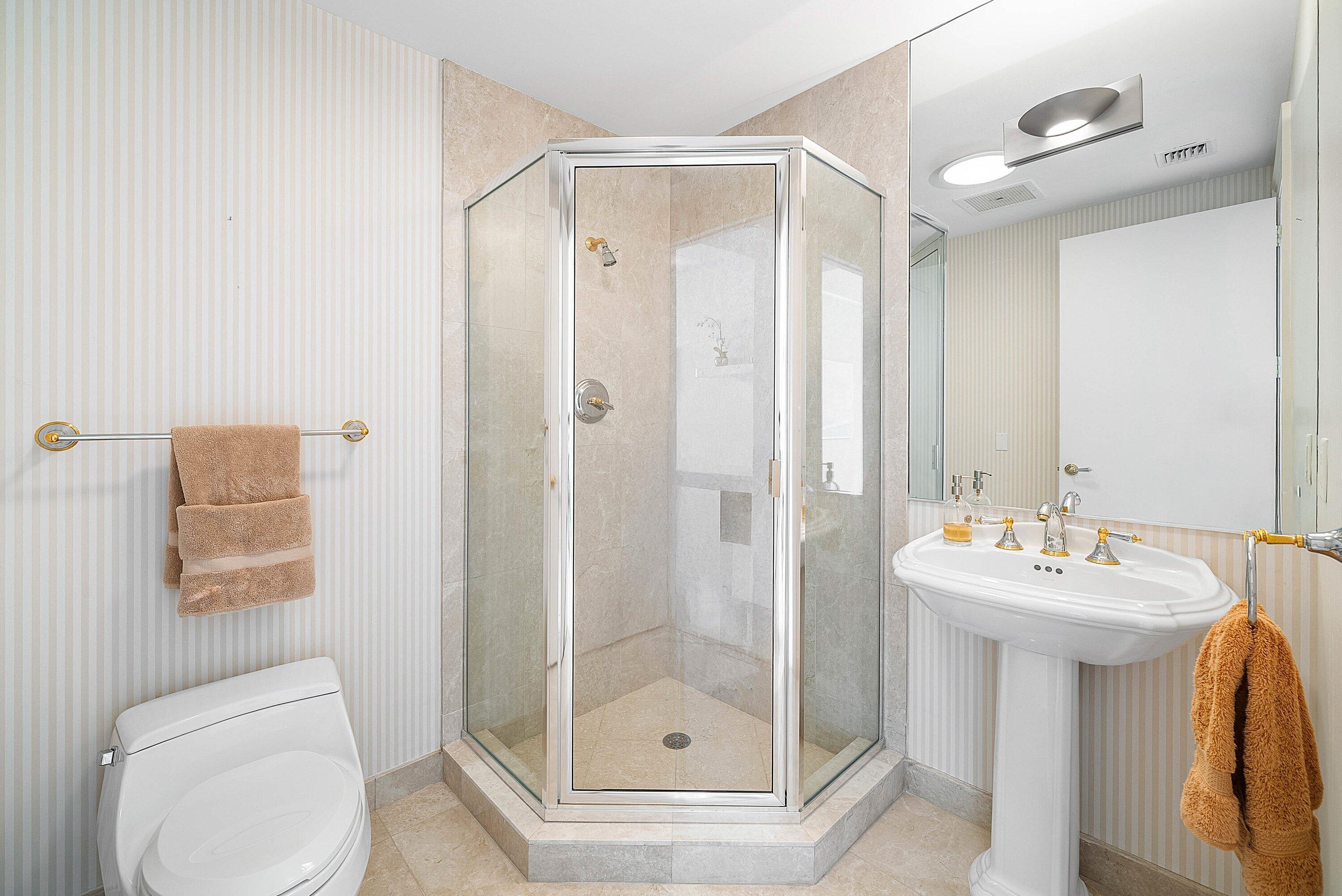 400 Southeast 5th Avenue, Unit 805N Boca Raton, FL 33432 - Photo 28 of 58 a bathroom with a shower a toilet and a sink