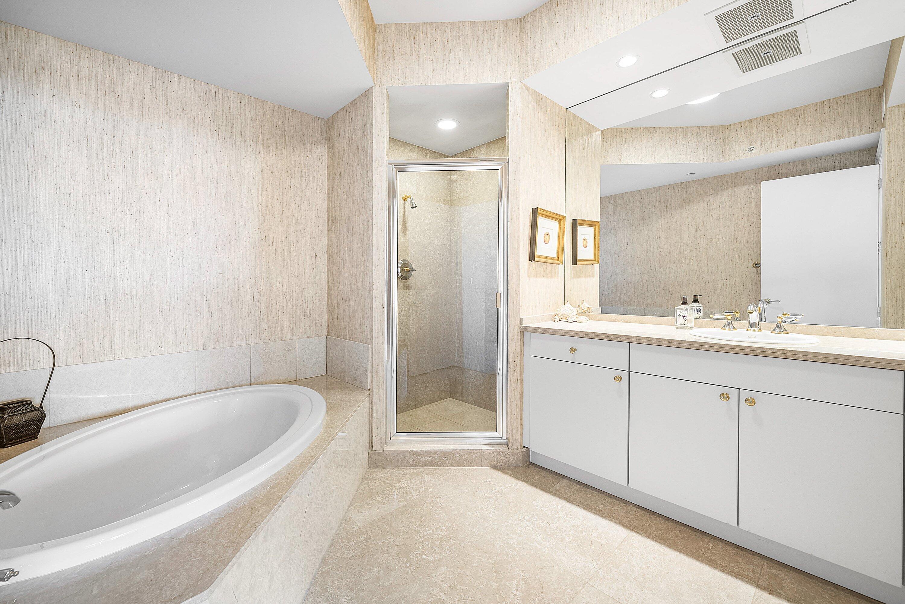 400 Southeast 5th Avenue, Unit 805N Boca Raton, FL 33432 - Photo 30 of 58 a spacious bathroom with a tub sink and mirror