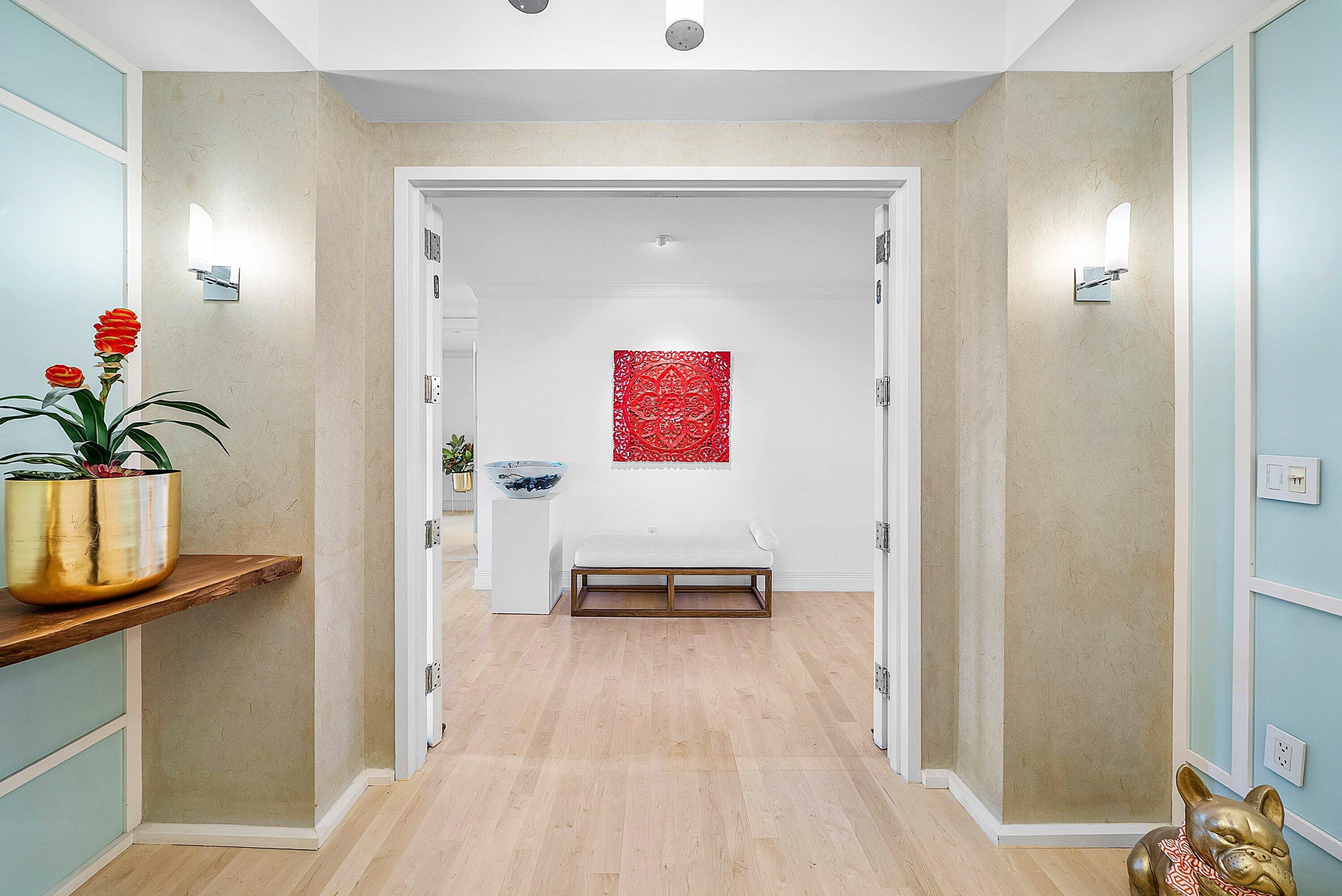 400 Southeast 5th Avenue, Unit 805N Boca Raton, FL 33432 - Photo 32 of 58 a en suite bathroom with a sink and a mirror