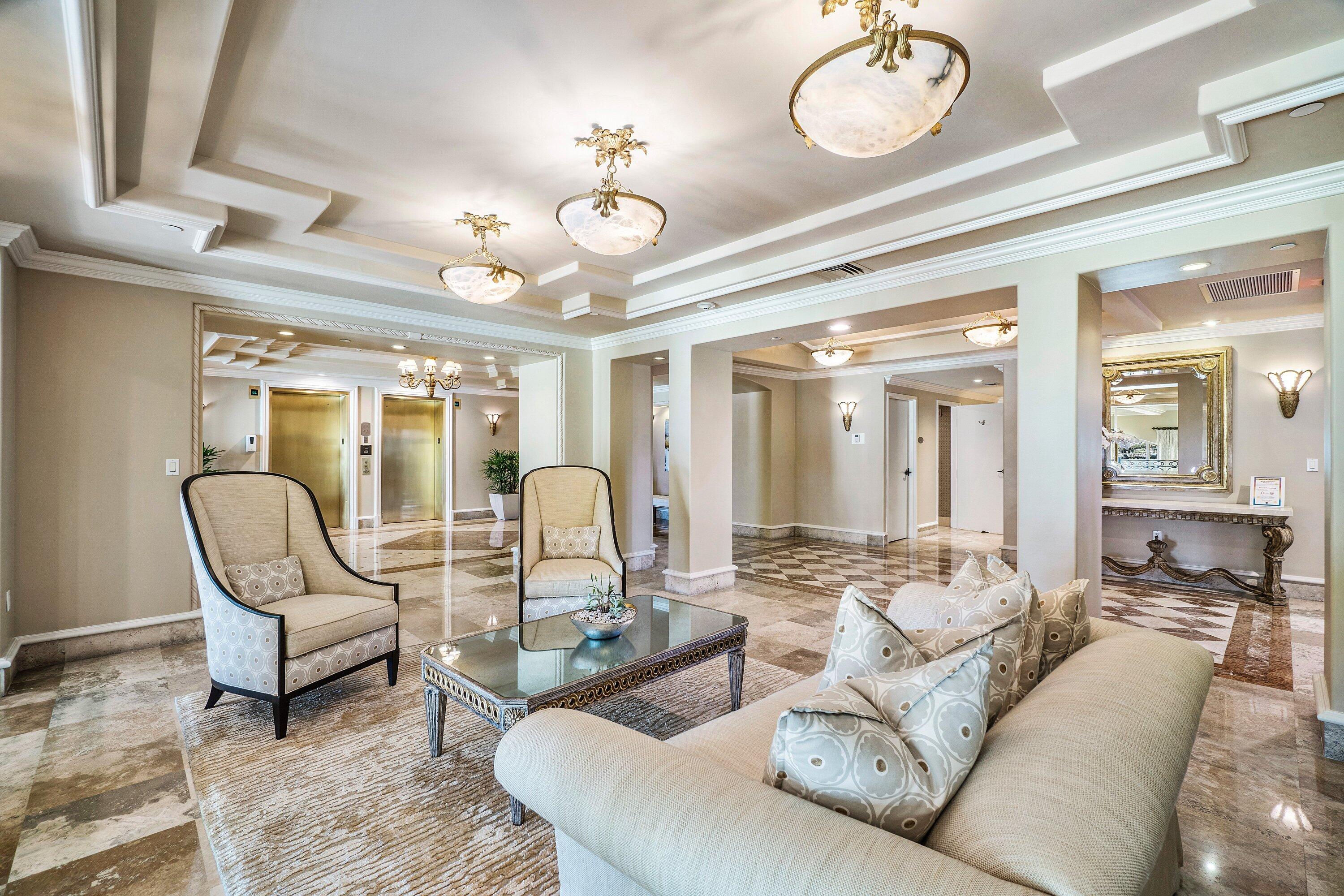 400 Southeast 5th Avenue, Unit 805N Boca Raton, FL 33432 - Photo 56 of 58 a living room with furniture a chandelier and a dining table