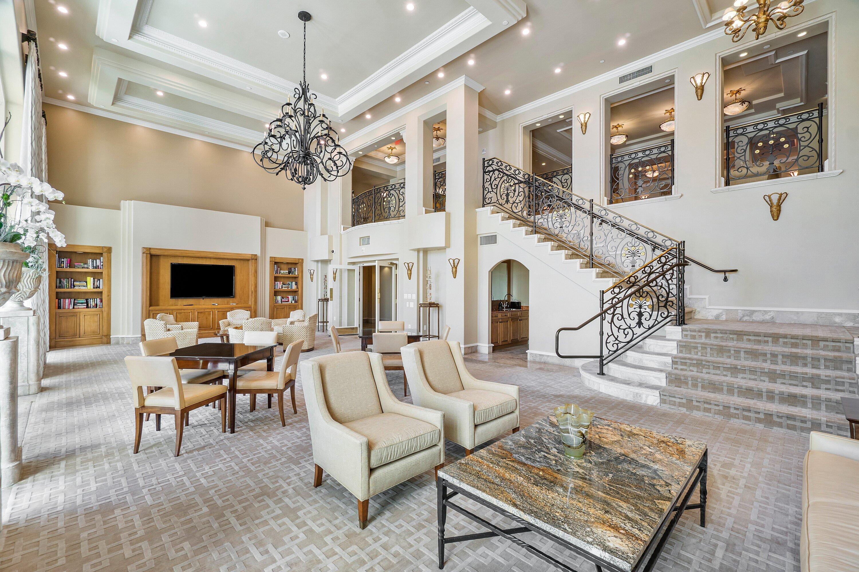 400 Southeast 5th Avenue, Unit 805N Boca Raton, FL 33432 - Photo 57 of 58 a living room with fireplace furniture and a chandelier
