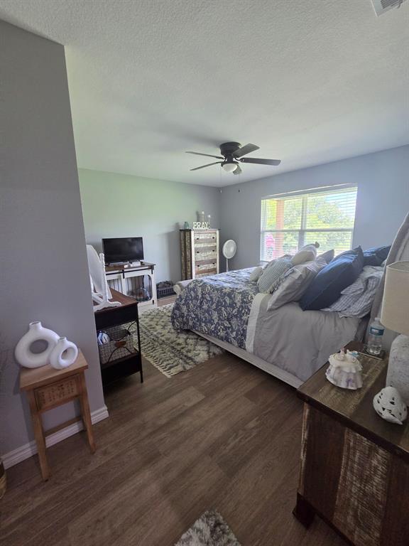 511 Erwin Road Poolville, TX 76487 - Photo 10 of 36 Spacious Primary Bedroom with 2 walk in closets.
