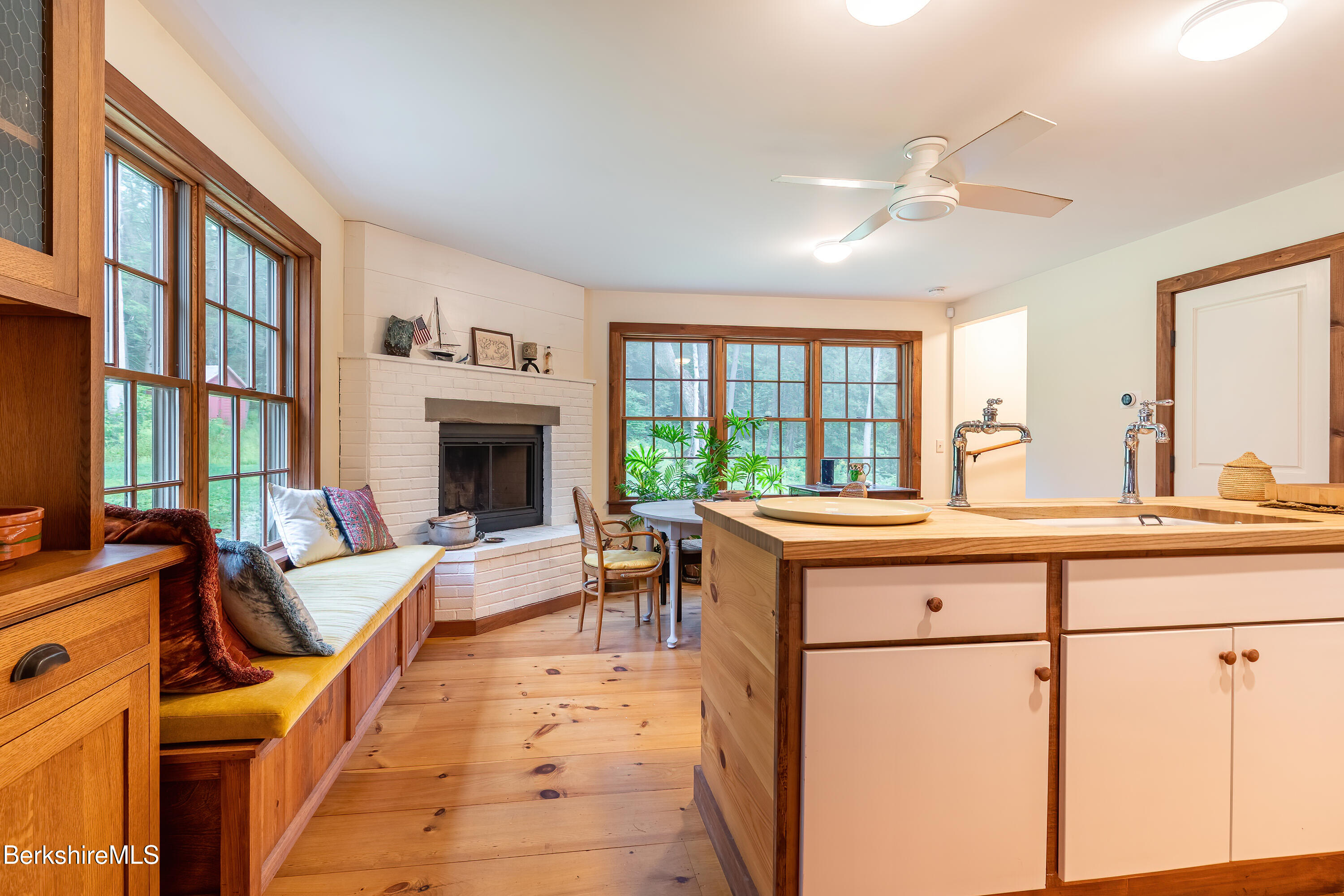 18 South Beech Plain Road Sandisfield, MA 01255 - Photo 21 of 32 a living room with furniture a fireplace and a large window