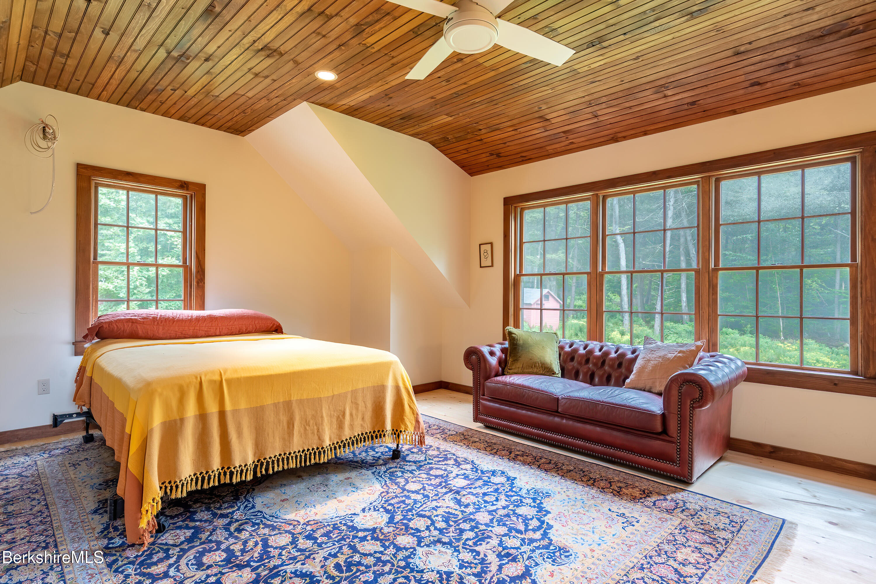 18 South Beech Plain Road Sandisfield, MA 01255 - Photo 23 of 32 a bedroom with a bed and wooden floor
