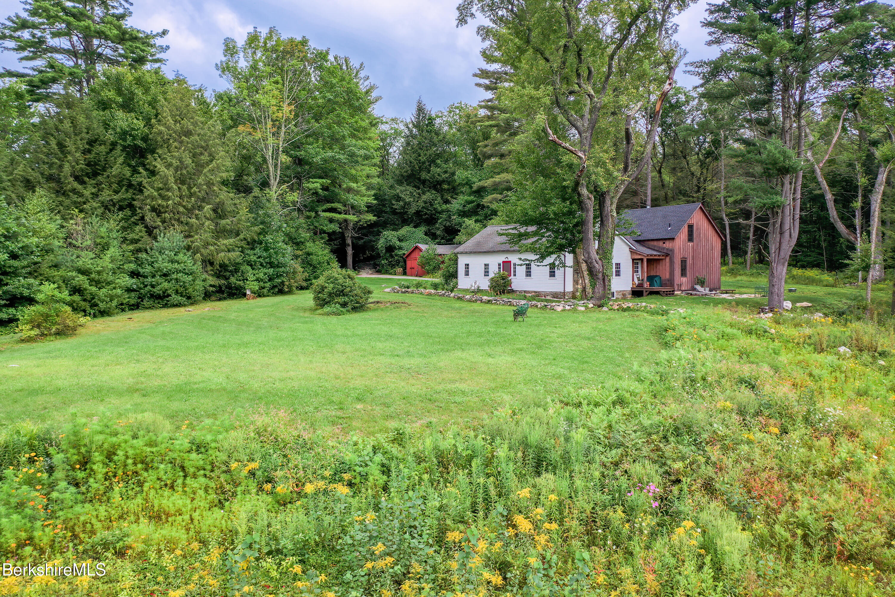 18 South Beech Plain Road Sandisfield, MA 01255 - Photo 32 of 32 a backyard of a house with table and chairs