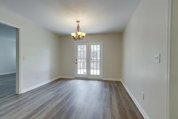 a kitchen with stainless steel appliances granite countertop a refrigerator a stove top oven a sink and dishwasher