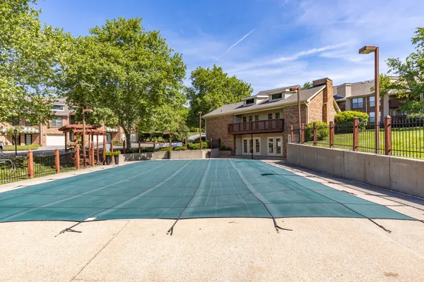 a view of a swimming pool with a patio