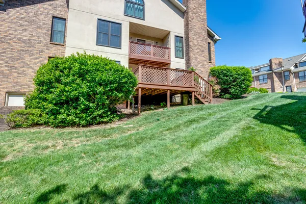 a view of a brick house with a yard