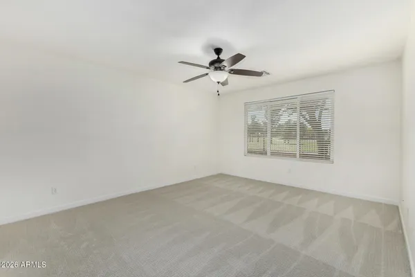 a view of a big room with carpet