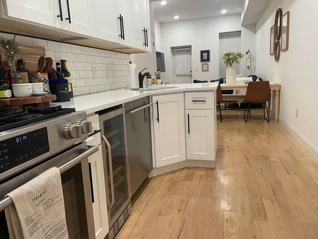 a view of living room with furniture and a potted plant