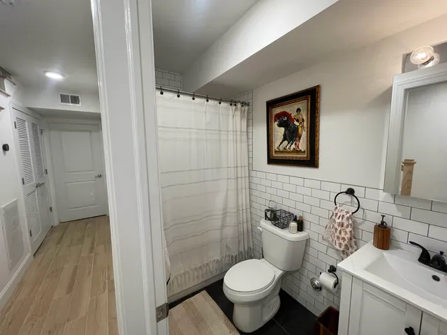 a bedroom with furniture and a window