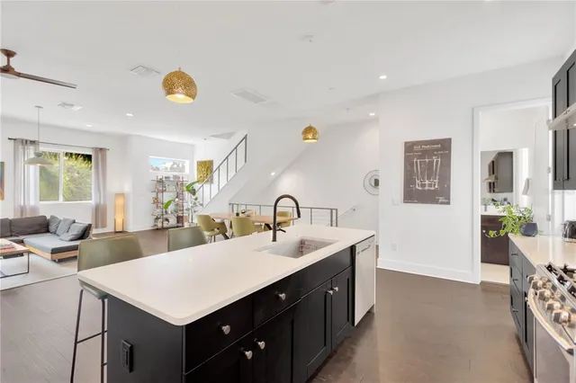 a view of living room with granite countertop furniture and wooden floor