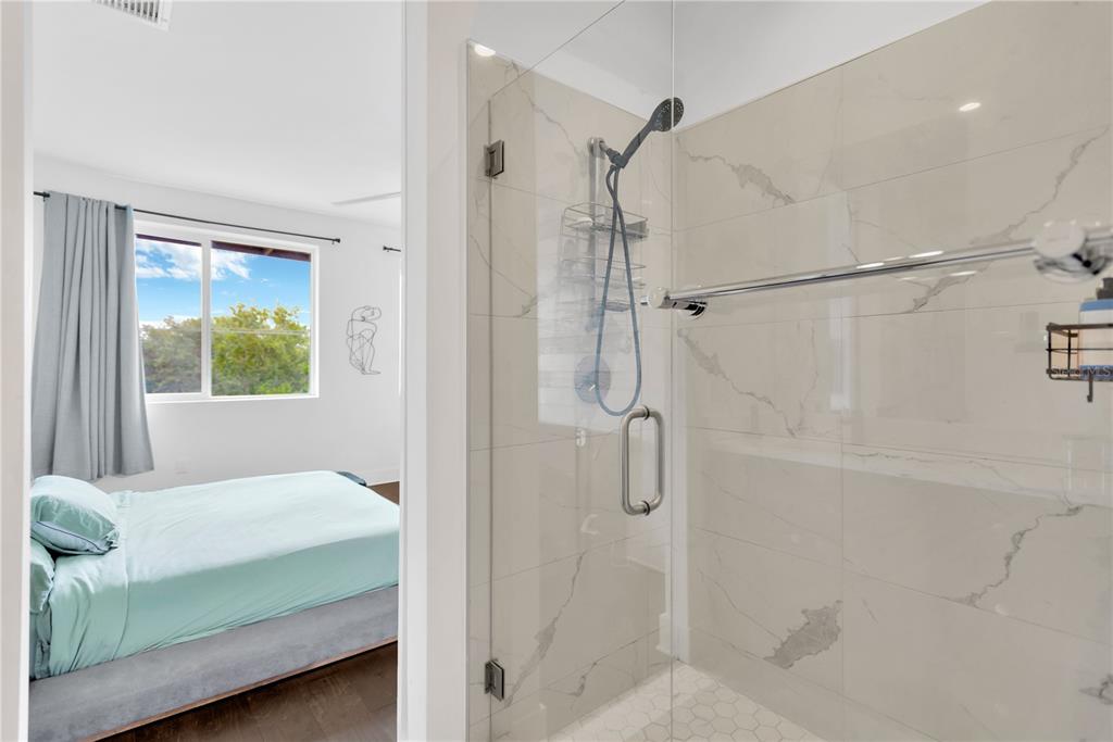 3100 West Paul Avenue, Unit 14 Tampa, FL 33611 - Photo 19 of 36 a bedroom with a bed and a window