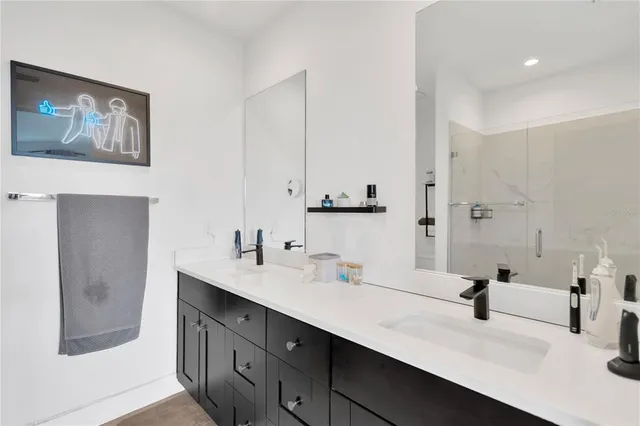a bathroom with 2 sink and a mirror