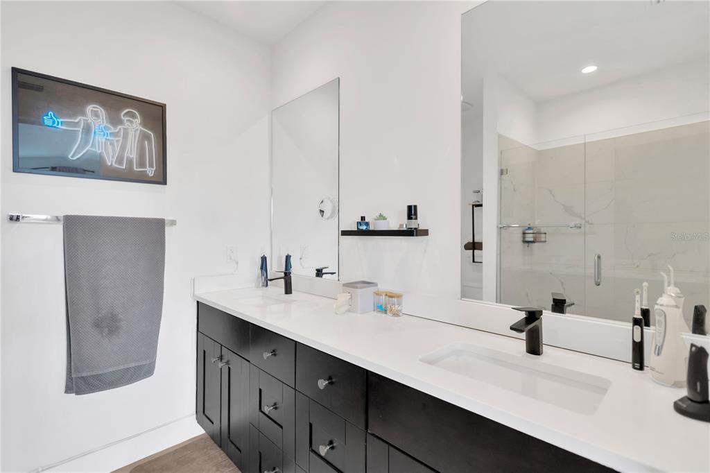 3100 West Paul Avenue, Unit 14 Tampa, FL 33611 - Photo 20 of 36 a bathroom with 2 sink and a mirror