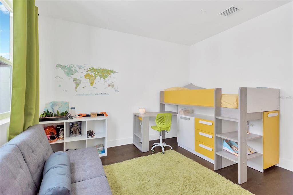 3100 West Paul Avenue, Unit 14 Tampa, FL 33611 - Photo 21 of 36 a living room with furniture and painting on the wall