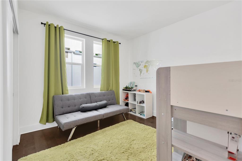 3100 West Paul Avenue, Unit 14 Tampa, FL 33611 - Photo 22 of 36 a living room with furniture and a large window