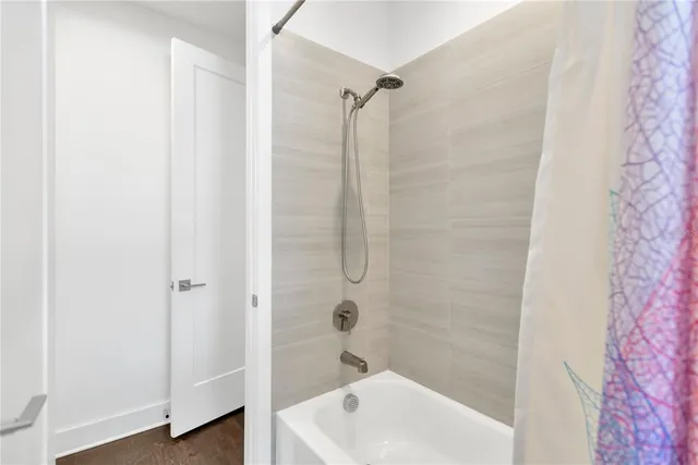 a bathroom with a shower and a sink