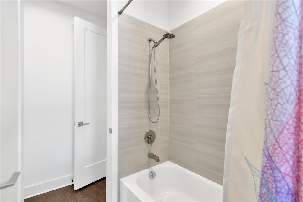 3100 West Paul Avenue, Unit 14 Tampa, FL 33611 - Photo 25 of 36 a bathroom with a shower and a sink