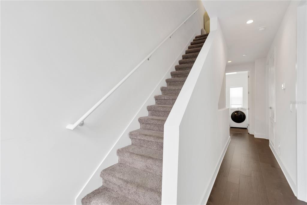 3100 West Paul Avenue, Unit 14 Tampa, FL 33611 - Photo 26 of 36 a view of entryway and hall with wooden floor