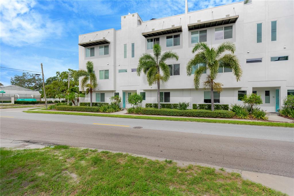 3100 West Paul Avenue, Unit 14 Tampa, FL 33611 - Photo 36 of 36 a view of a house with a yard and plants