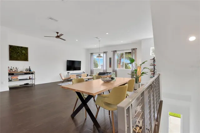 a view of a livingroom with furniture and a flat screen tv