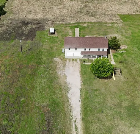 a aerial view of a house with a lake view