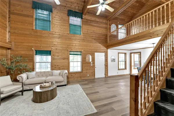 a living room with furniture and a potted plant