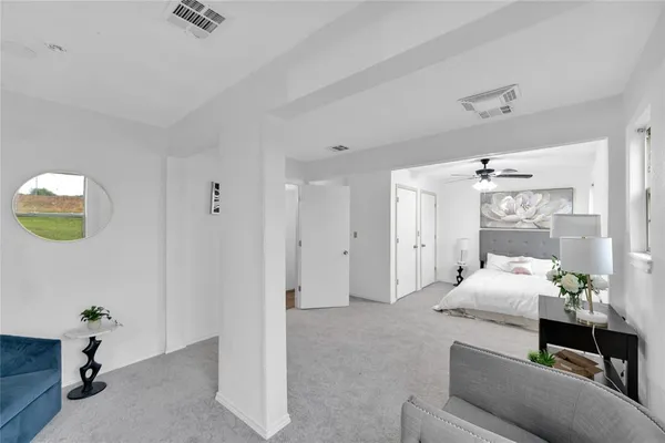 a bedroom with furniture and a chandelier