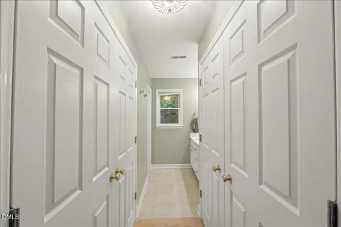 a view of a hallway with a white walls