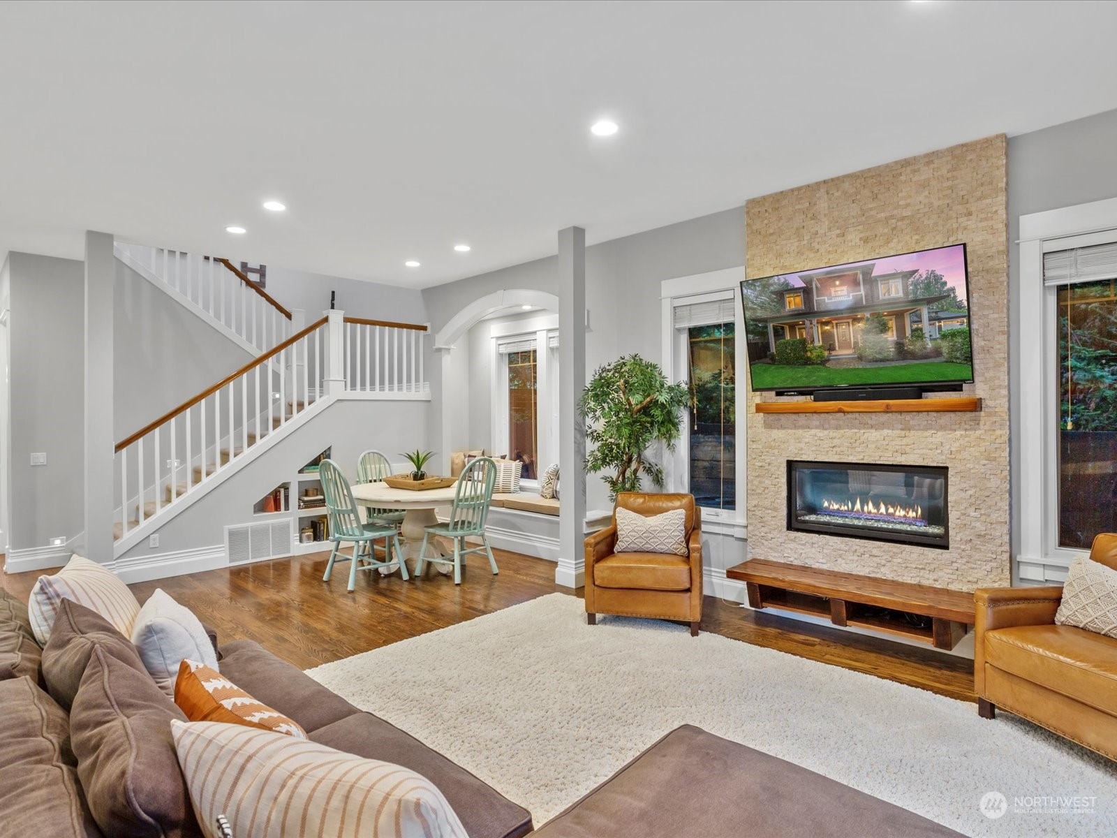 816 13th Street Snohomish, WA 98290 - Photo 11 of 34 a living room with furniture a flat screen tv and a fireplace