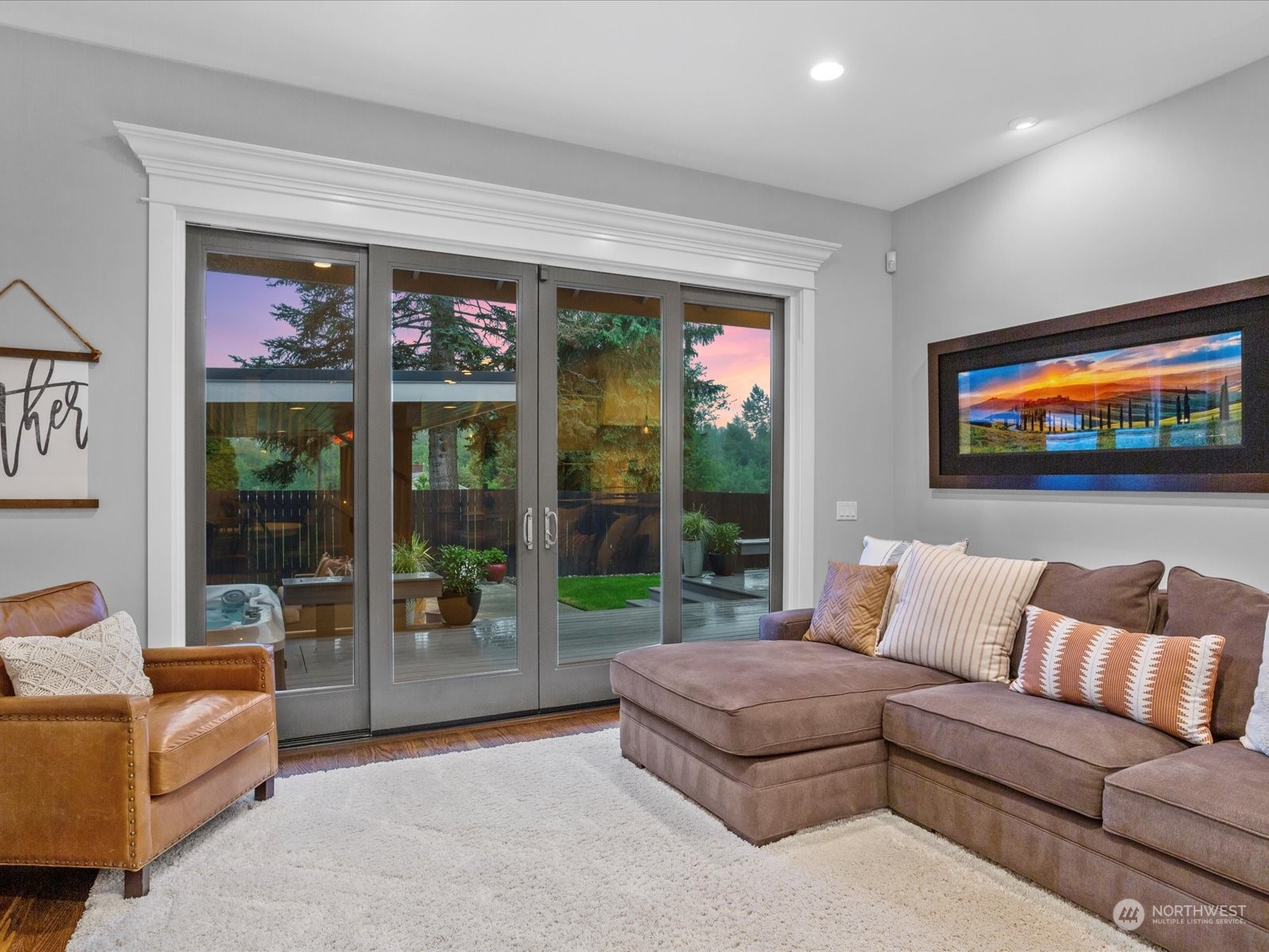 816 13th Street Snohomish, WA 98290 - Photo 13 of 34 a living room with furniture a floor to ceiling window and a flat screen tv