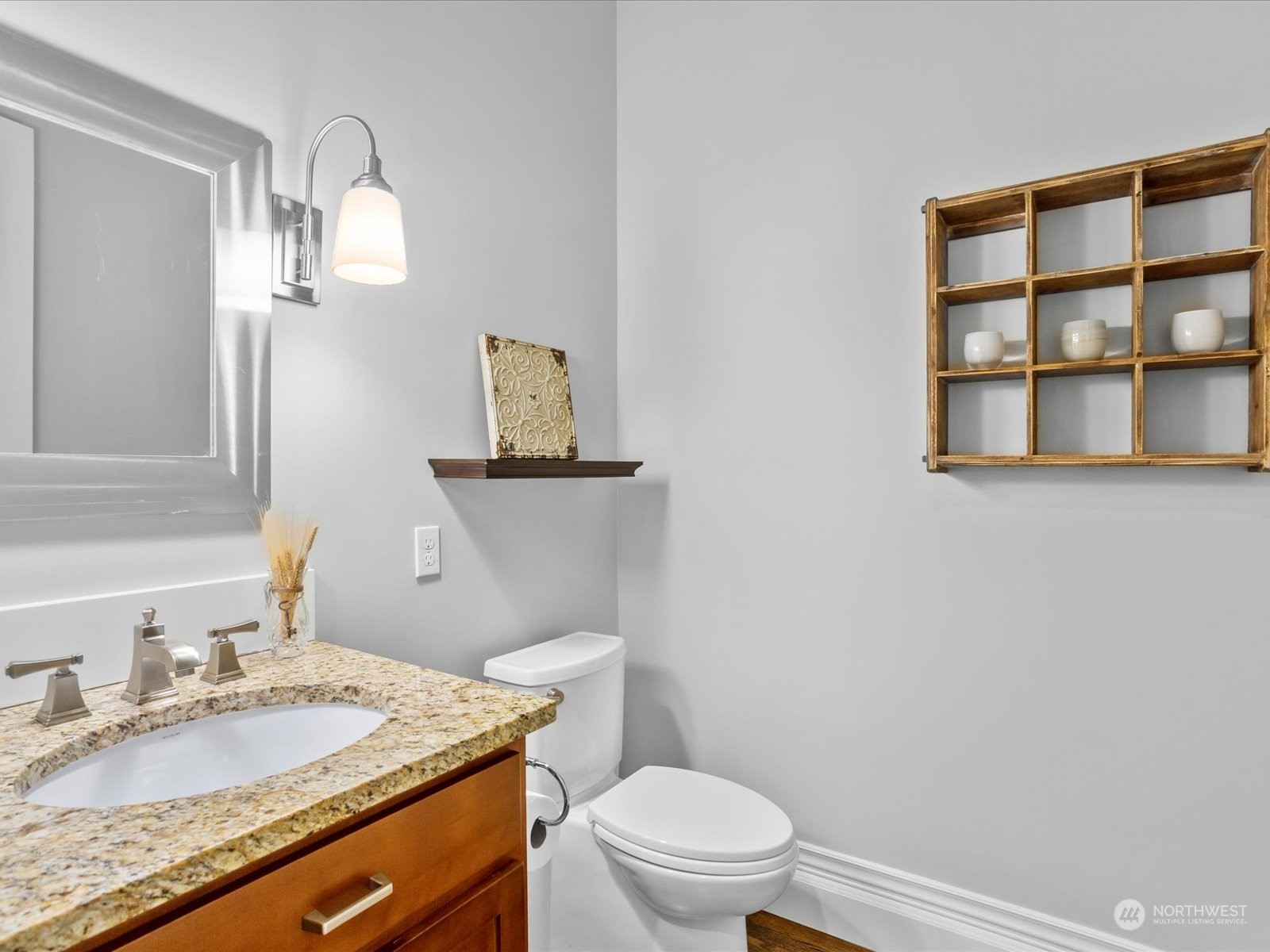 816 13th Street Snohomish, WA 98290 - Photo 29 of 34 a bathroom with a granite countertop toilet sink and mirror