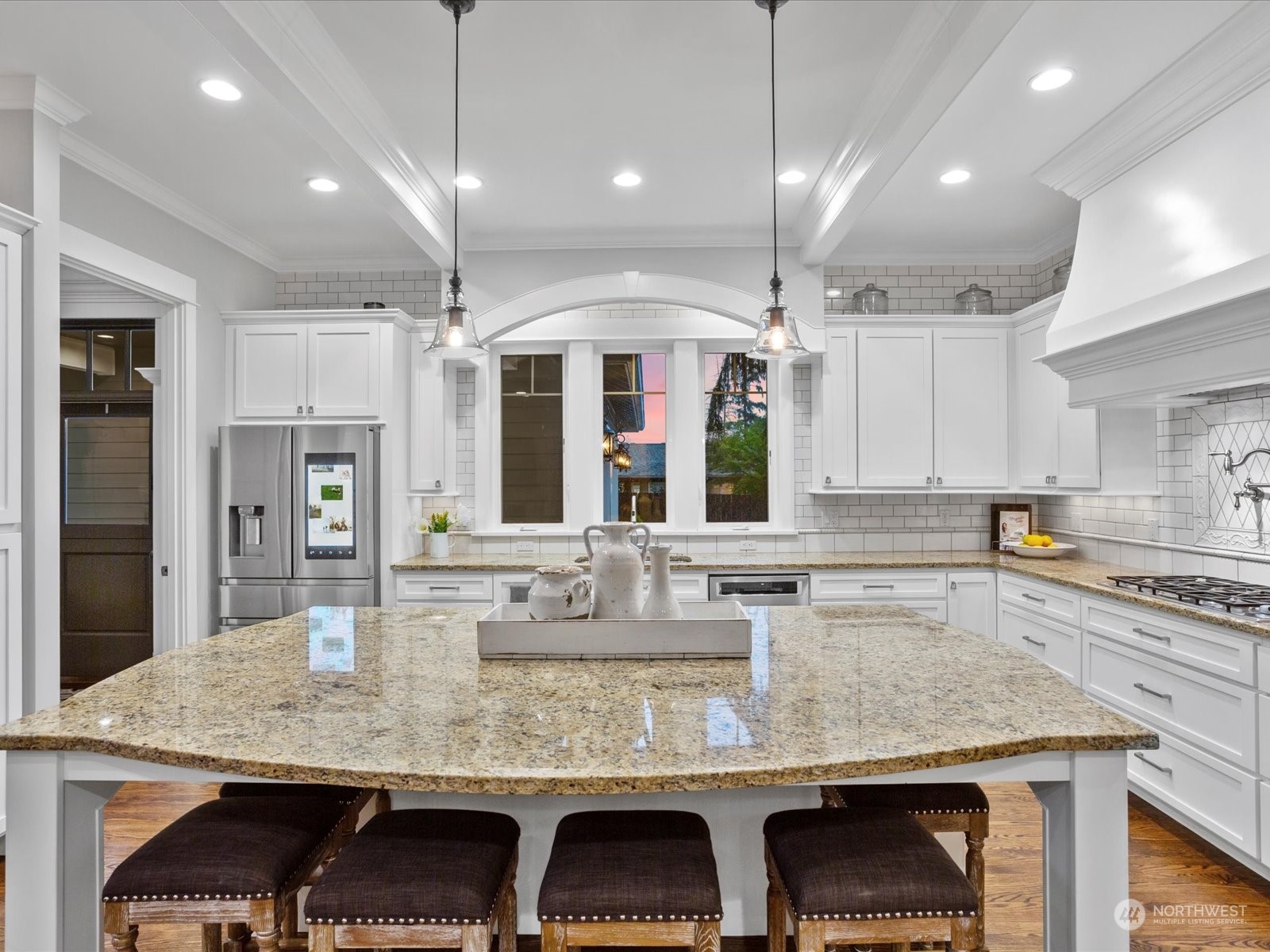 816 13th Street Snohomish, WA 98290 - Photo 6 of 34 a kitchen with kitchen island granite countertop a table and chairs in it