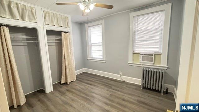 760 Hamilton Street, Unit 1 Harrison, NJ 07029 - Photo 7 of 23 an empty room with wooden floor cabinet and windows