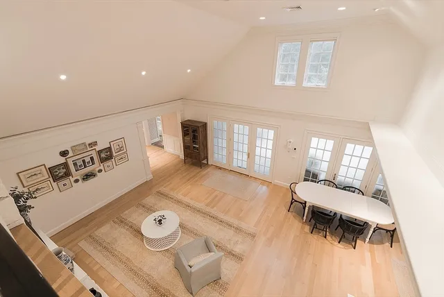 a view of a livingroom with furniture and a window