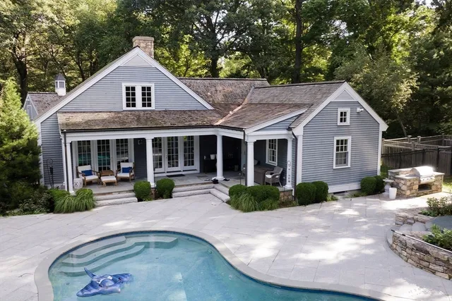 a front view of a house with a yard and porch